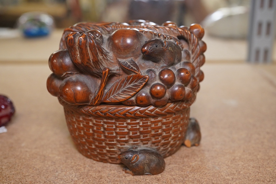 A Japanese boxwood koro and cover, Meiji period, modelled as a basket of fruit with mice, signed to the base, 9cm wide. Condition - fair to good, some chipping